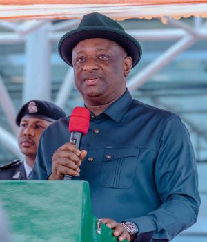 Nigerian Aviation Minister Festus Keyamo speaking into a microphone at a public event while standing behind a podium.