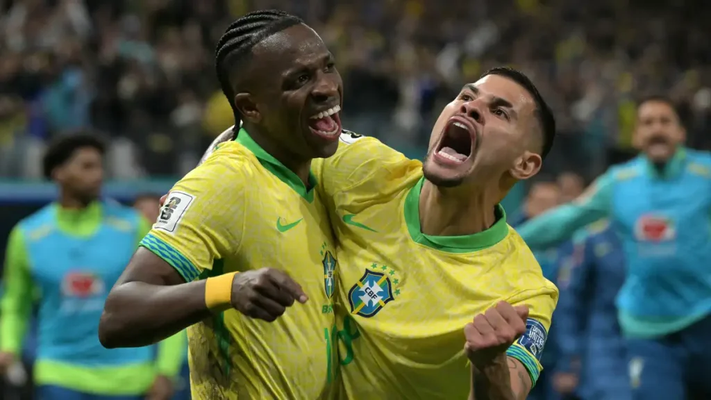 Brazil stars Vinicius Junior and Bruno Guimaraes celebrate during an international football match amid Arsenal transfer speculation.