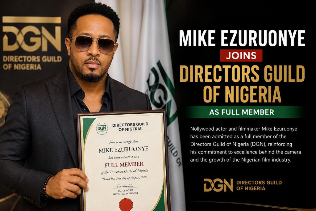 Mike Ezuruonye holding a Directors Guild of Nigeria membership certificate.