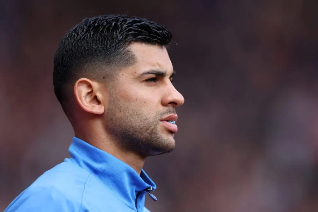 Cristian Romero pictured in a Tottenham training jacket.