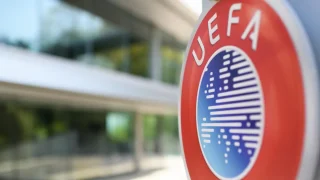 UEFA logo displayed outside the European football governing body's headquarters following its statement welcoming FIFA's withdrawal of plans to sell a stake in the World Cup.